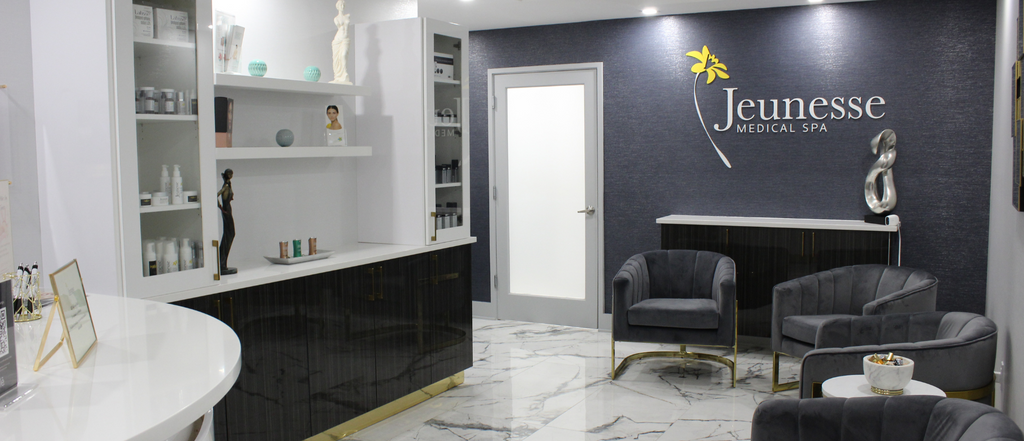 Clean, professional medical spa treatment room with neutral tones at Jeunesse in Holmdel